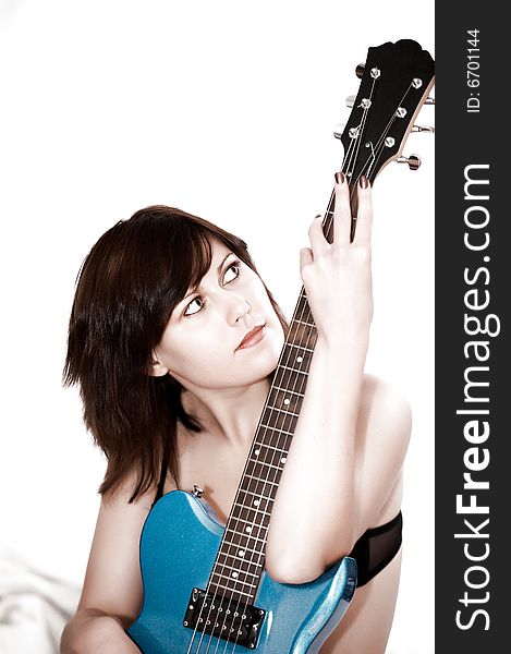 Young beautiful woman with guitar