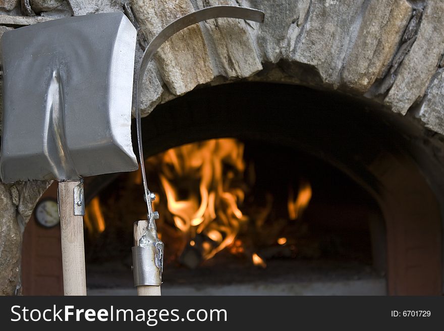 Oven for the pizza with fire and cooking gear. Oven for the pizza with fire and cooking gear