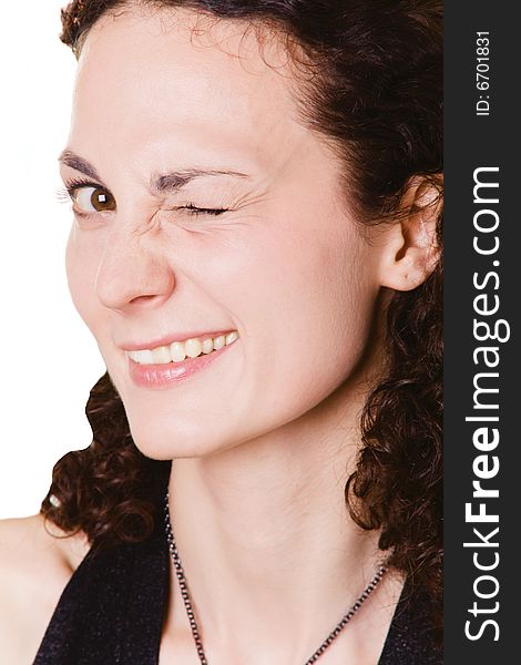 Young woman winking with one eye on white background