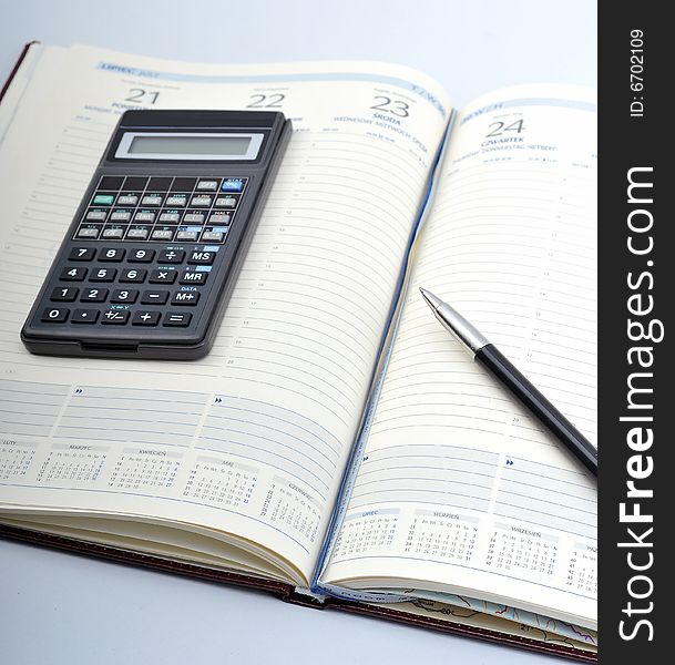 Image of year planner with pen and calcularor - budget time. Image of year planner with pen and calcularor - budget time