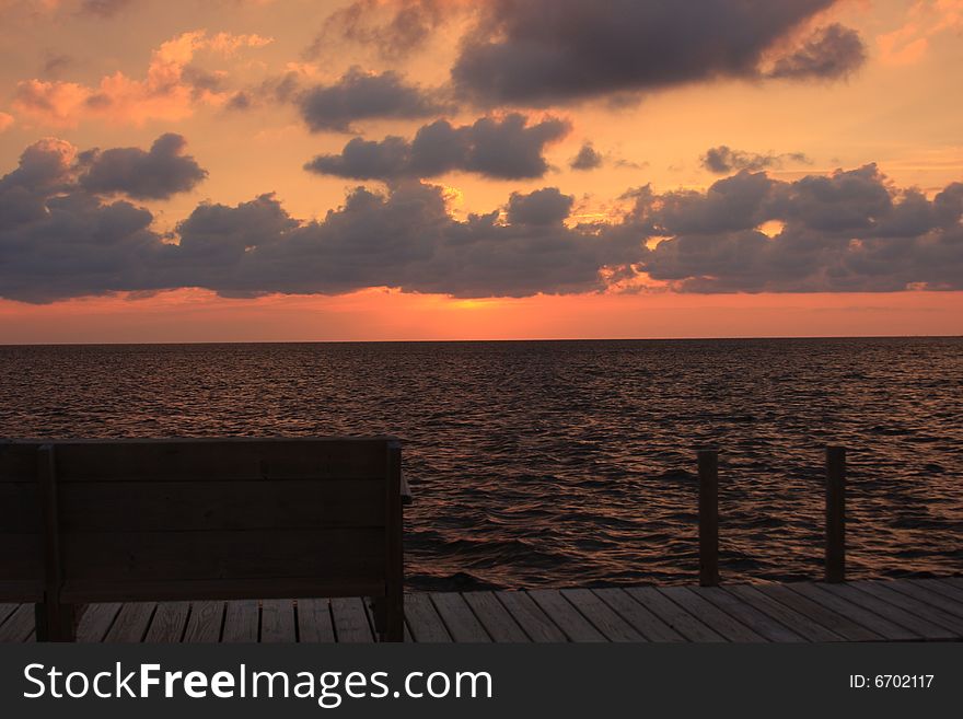 Bench and Sunset located on the Pamlico Sound in the Outer Banks, North Carolina