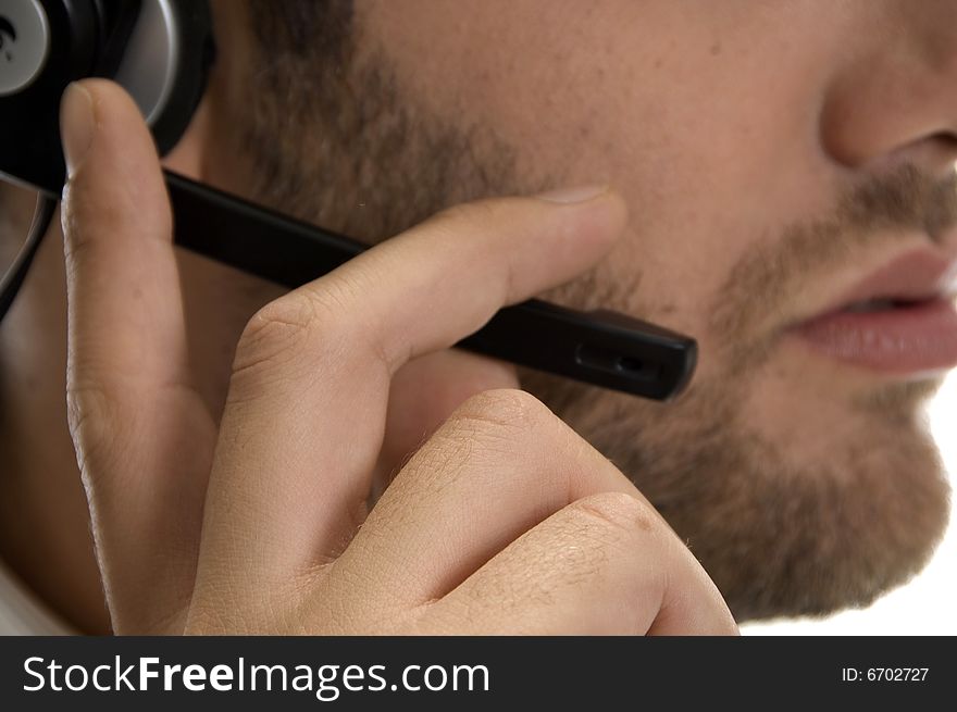 Close up of young businessman adjusting his headset