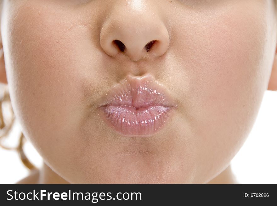 Close view of lips of girl on an isolated background