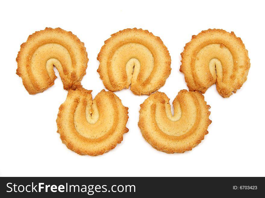 Many pieces of cookies isolated on white background.