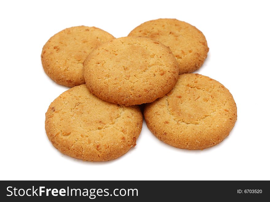 Many pieces of cookies stacked on white background.