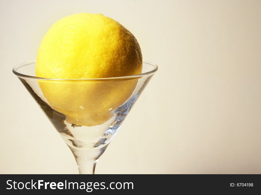 Abstract scene lemon in liquor-glasse. Abstract scene lemon in liquor-glasse