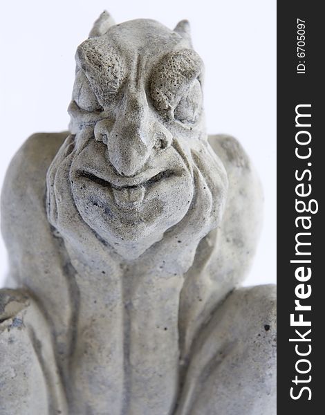 Scary gargoyle statue on white background.