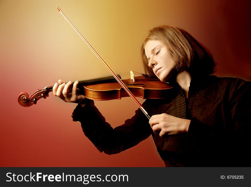 Young woman playing the violin