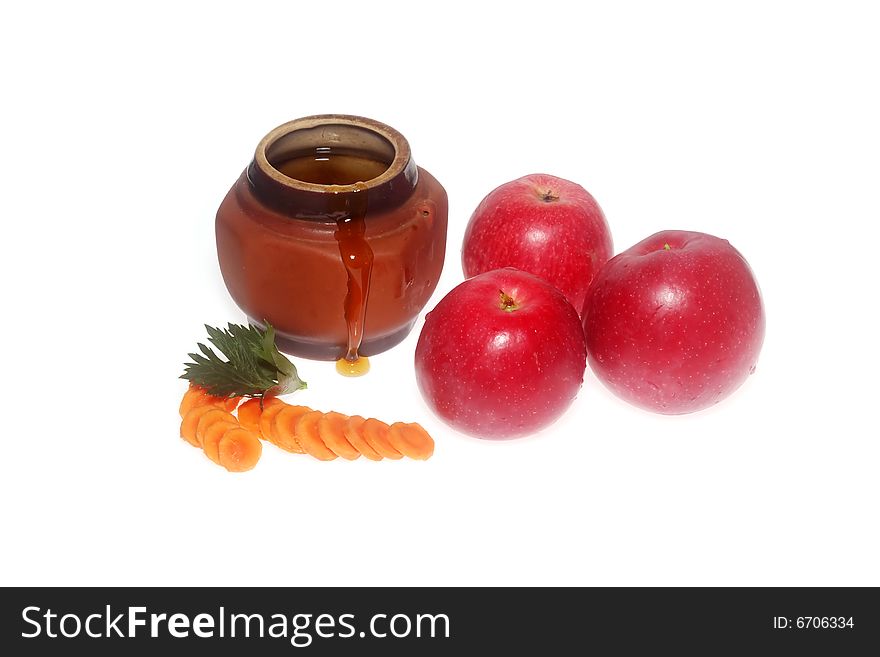 Apples and honey on a white background. Apples and honey on a white background