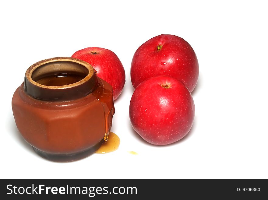 Apples and honey on a white background. Apples and honey on a white background