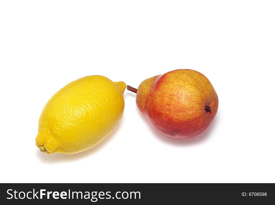 Fresh yellow lemon and red pear isolated on white background