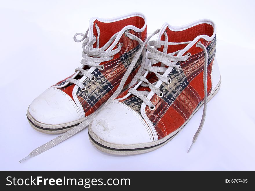 Teenage red checkered shoes on white background