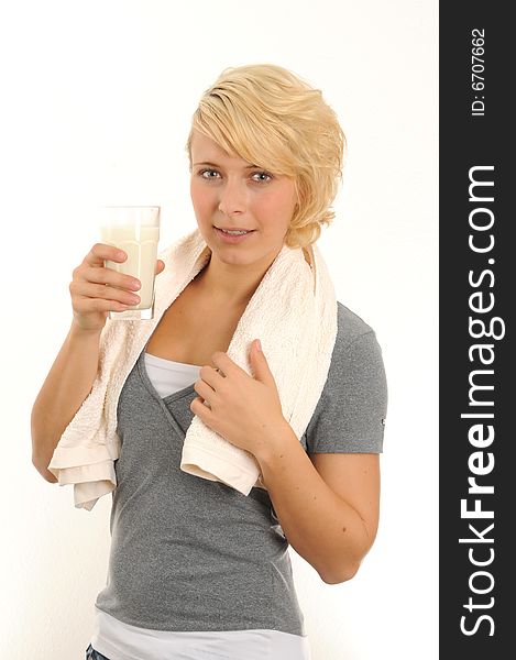 Young woman is drinking a glass of milk.Isolated over white. Young woman is drinking a glass of milk.Isolated over white.