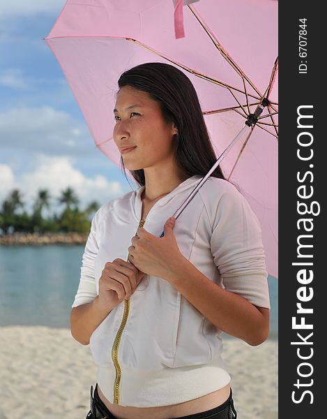 Woman with umbrella the beach. Woman with umbrella the beach.