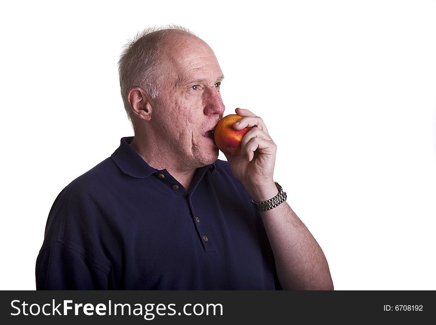 Old Bald Guy Enjoying A Peach