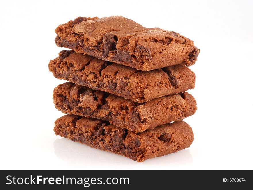 Pile of chocolate brownie cookies on a white background. Pile of chocolate brownie cookies on a white background.