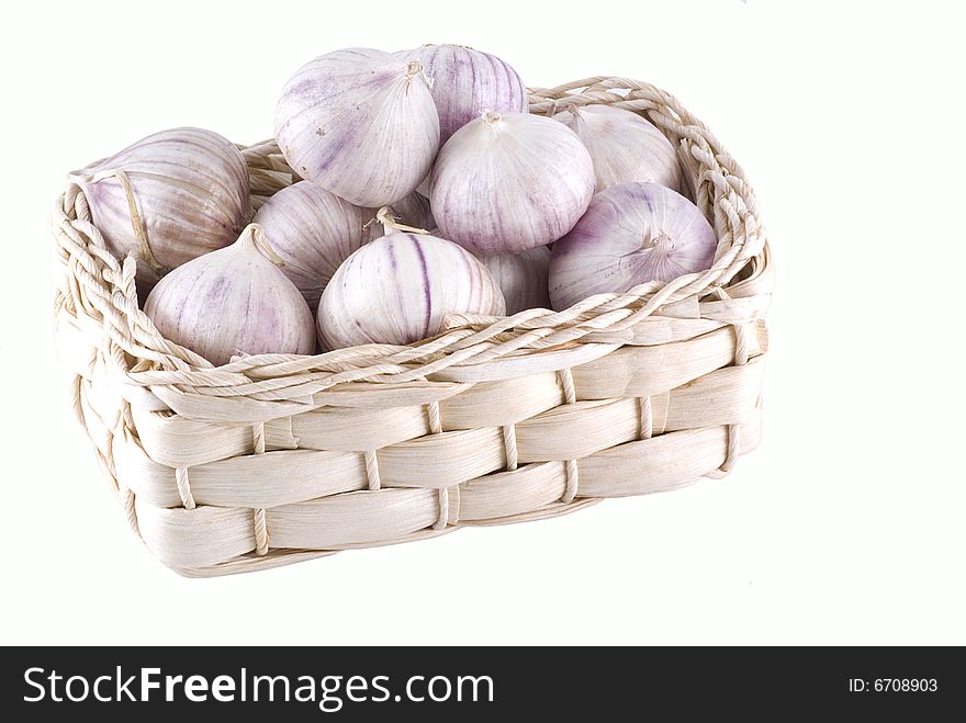 Basket with beautiful garlic isolated on white. Basket with beautiful garlic isolated on white.