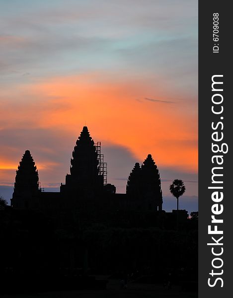 Angkor Wat in silhouette during sunrise. Angkor Wat in silhouette during sunrise.