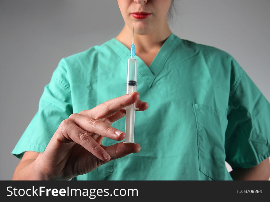 a doctor holding a syringe