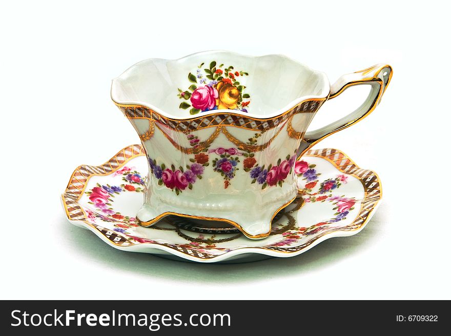 Teacup with dish decorated with flowers