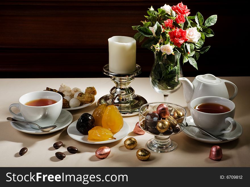 Cup of tea and sweet on a table