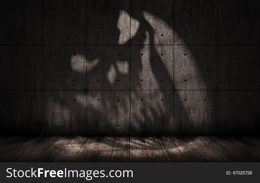 Grunge background with shadow in the shape of a skull