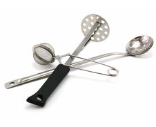 Two Perforated Spoons And Tea Strainer Royalty Free Stock Photo