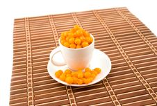 White Cup With Buckthorn Berries Stock Photos White Cup With Buckthorn Berries Stock Photos