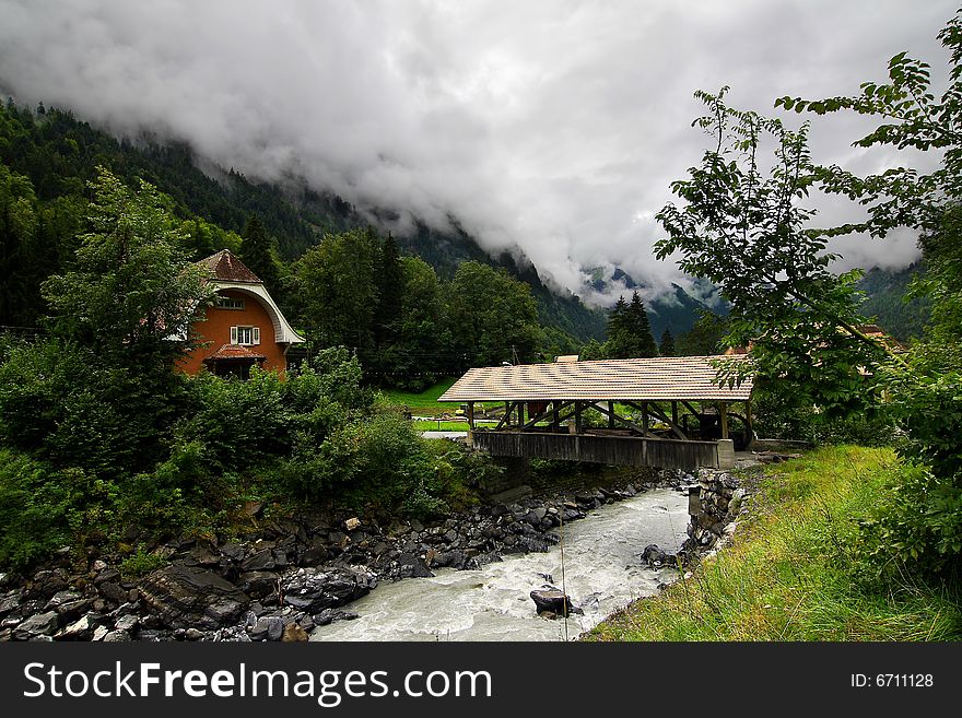 Mountains, the river and cloudy sky. Mountains, the river and cloudy sky