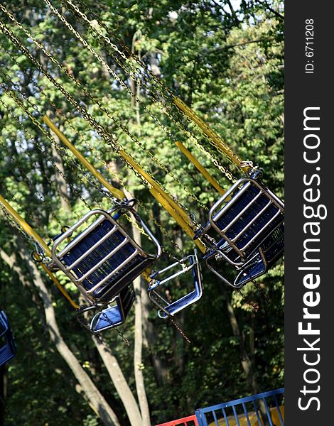 Picture of a flying swing at the amusement park. Picture of a flying swing at the amusement park.