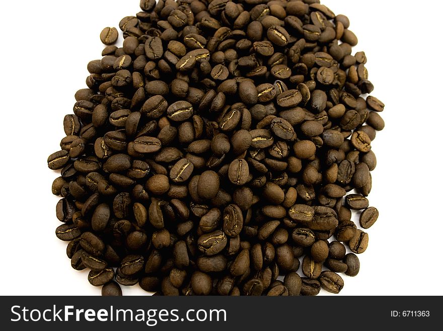 Small group of grains of coffee isolated on a white background