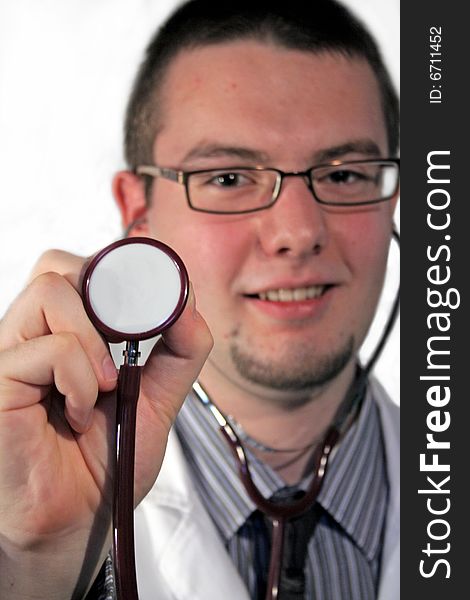 Doctor holding stethoscope in his arm