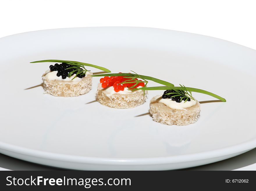 Black and red caviar on plate