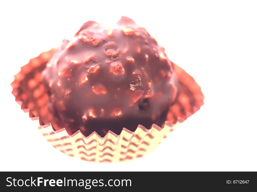 Close-up shot of a chocolate sweet in back light