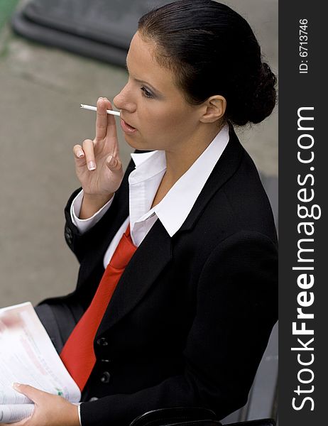 Portrait of businesswoman with cigarette