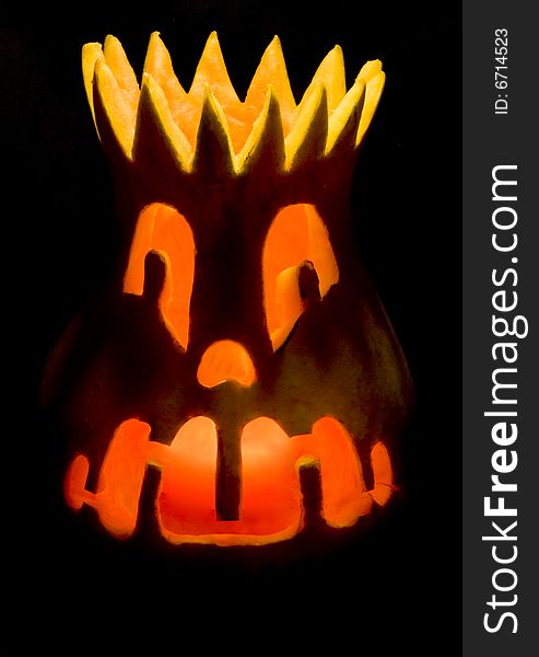 Grinning Halloween lantern over black background