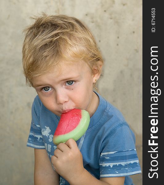 Four year old boy with watermelon icecream. Four year old boy with watermelon icecream