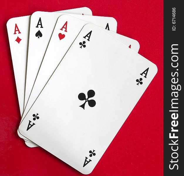 Four aces on the red background