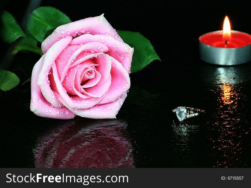 Rose with Diamond Ring on Dark Glass. Rose with Diamond Ring on Dark Glass