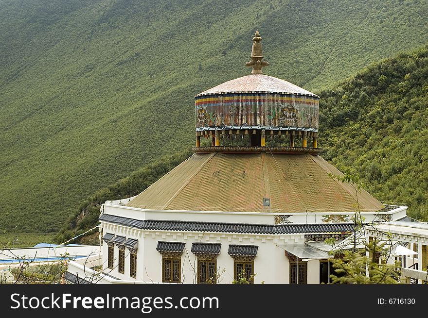 Building in Tibetan style surrounded by mountains around Shangrila town, Yunnan province, China. Building in Tibetan style surrounded by mountains around Shangrila town, Yunnan province, China.