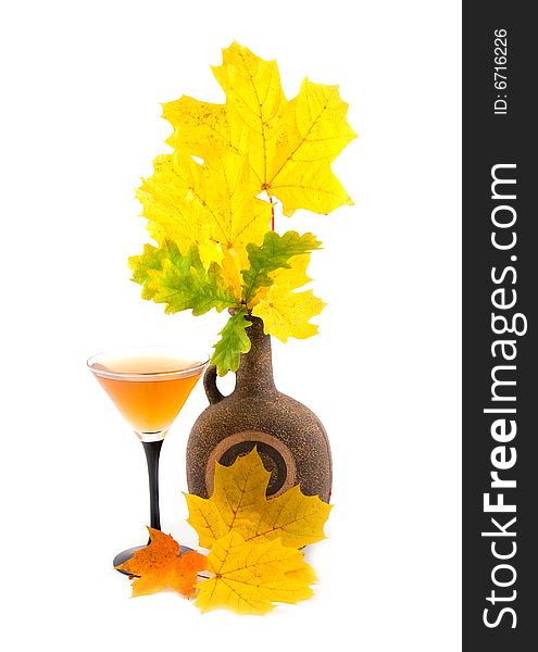 An autumn bouquet from maple and oak branches with yellow leaves on white background. An autumn bouquet from maple and oak branches with yellow leaves on white background