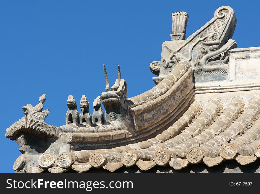 Traditional and beautiful fastigium with a lot of mythical animals,the old architecture of China. Traditional and beautiful fastigium with a lot of mythical animals,the old architecture of China