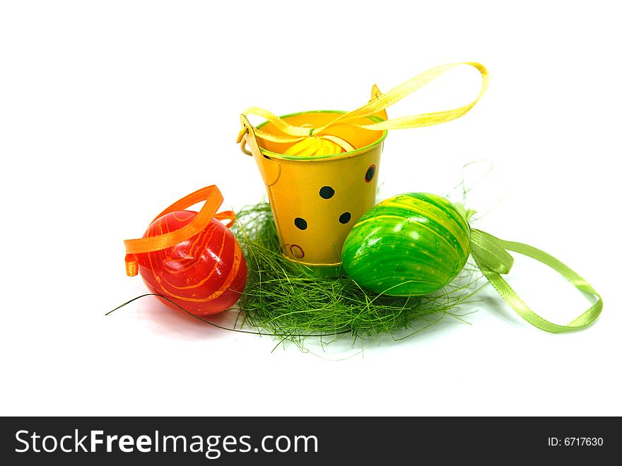 Green, yellow and red eggs for eastern and a cup. Green, yellow and red eggs for eastern and a cup