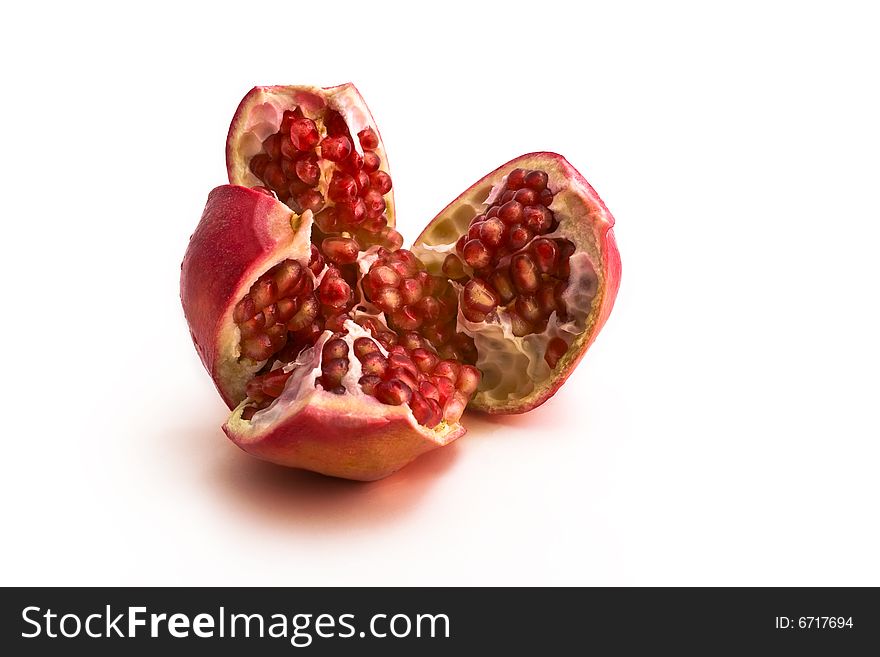 Pomegranate close-up isolated on white background