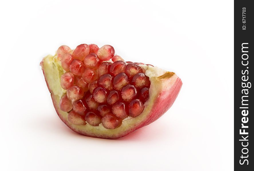 Pomegranate close-up isolated on white background