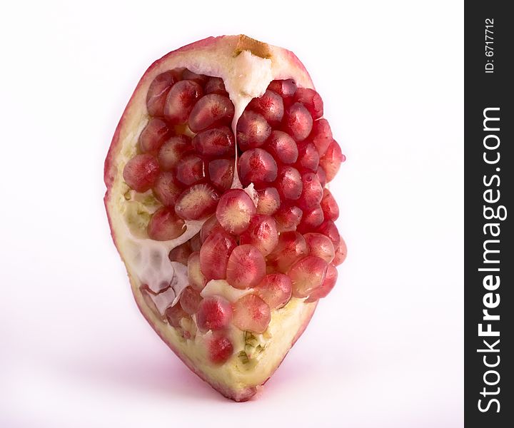 Pomegranate close-up isolated on white background