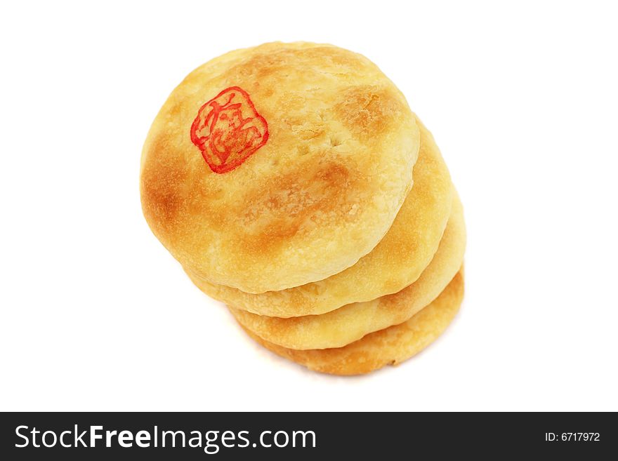 Chinese cream pastry stacked together on white background.