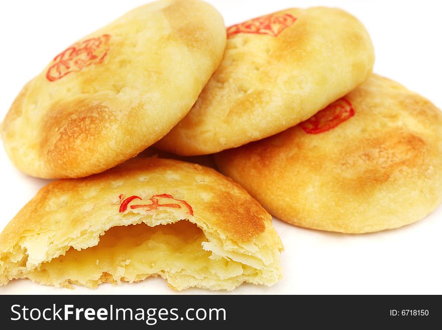 Close up of Chinese cream pastry stacked together.