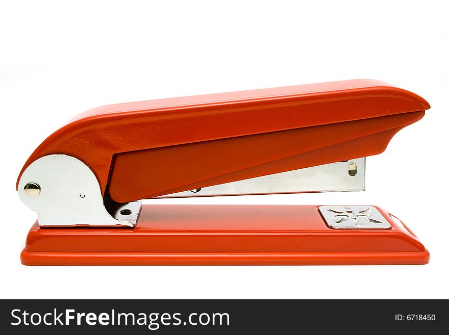 Red stapler on a white background