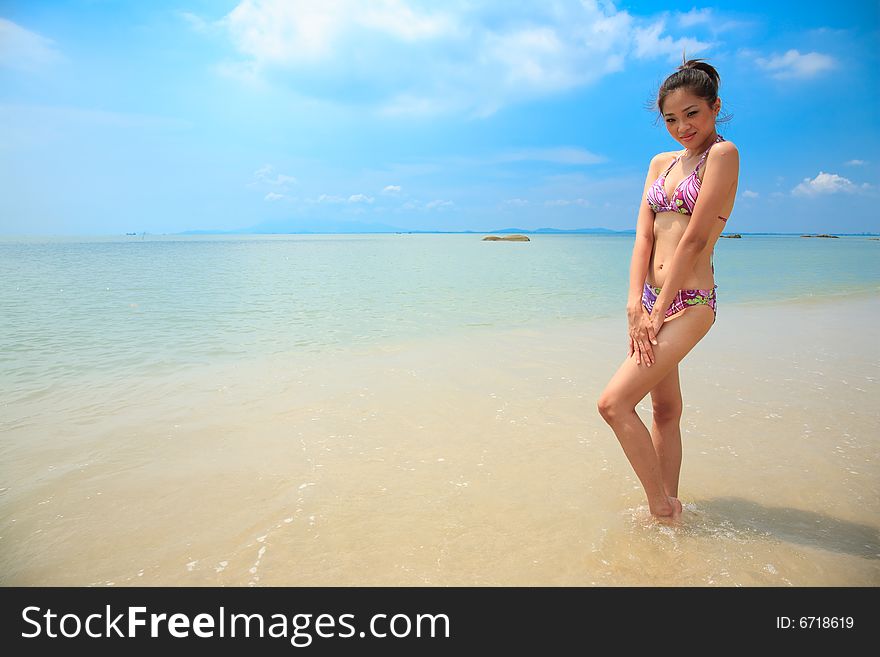 Sexy gorgeous asian woman on a beautiful tropical beach. Sexy gorgeous asian woman on a beautiful tropical beach